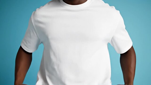 Oversized white cotton tshirt mockup featuring a stylish African American male model standing against a minimal light blue background, front view of casual blank apparel for design presentation.