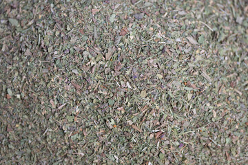 Fototapeta premium Dried plant blend for teas, Herbal blend with leaves and stems for soothing beverages, Dried herb mixture featuring leaves and stems in muted green for calming infusions