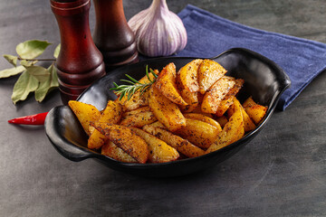 Baked crispy hot potato with rosemary
