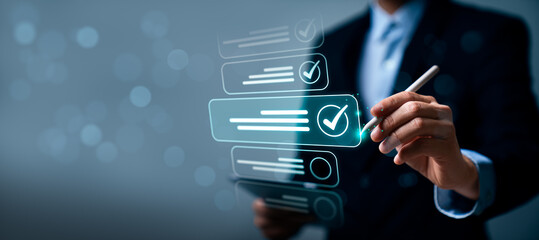 Obraz premium Business professional using digital checklist interface with checkmark icons, representing task completion, quality control, workflow management, and process verification