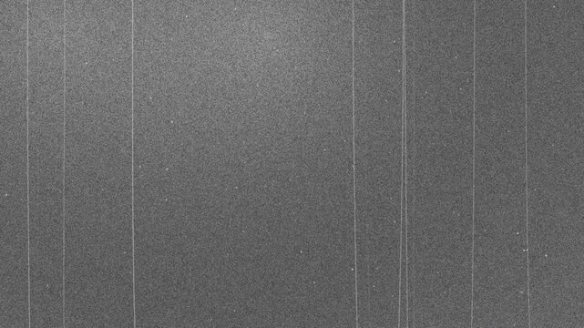 Abstract digital noise grain texture. Grey static interference background overlay. TV signal glitch and fuzz effect.