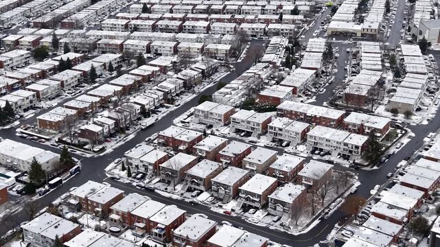 Aerial winter view of Montreal suburbs, snowy angrignon park and river near Lachine and Verdun under cloudy sky. g.