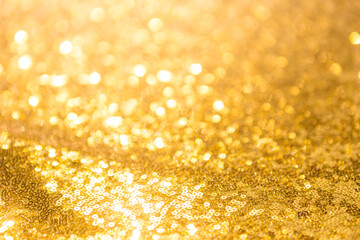 Close up blurred gold bokeh background, abstract shiny gold texture background