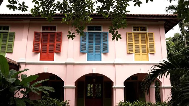Pink Shophouse with Colorful Windows.