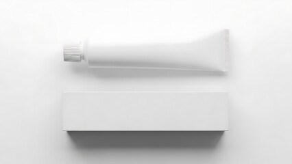 White toothpaste tube and box on plain background packaging