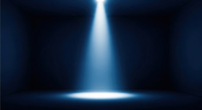 Dramatic spotlight effect with bright blue light beam in dark background