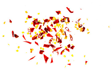 Close up spicy chili red pepper flakes, chopped, milled dry paprika pile isolated on white