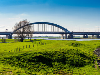 Fototapeta premium Historic Lek bridge spanning Lek river near Vianen