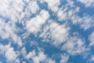 Fototapeta premium Fluffy white clouds against blue sky