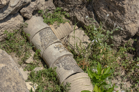 An ancient pipeline on the ruins of an ancient city. Water supply in the ancient city. An ancient device for water supply and sewerage. Ruins in the ancient city of Perge.