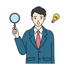 Surprised school boy holding magnifying glass with light bulb idea