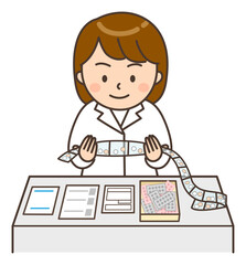 調剤された薬を鑑査する若い女性薬剤師