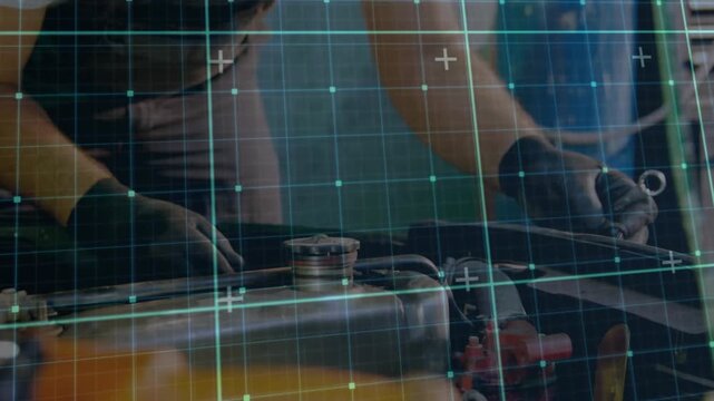 Animation of grid pattern over caucasian male mechanic repairing vehicle in garage