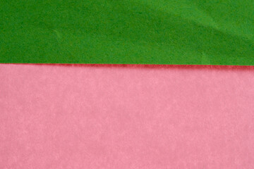 Fototapeta premium Colorful layers of green and pink paper shine under daylight