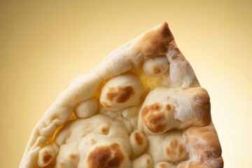 Close up of a quartered naan bread baked
