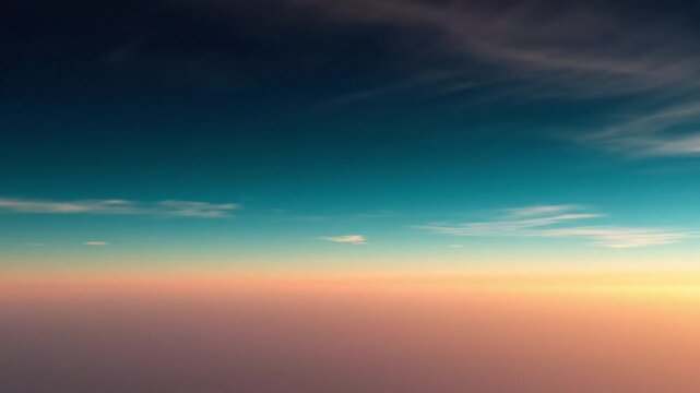Panoramic view of a serene sunset with a gradient sky transitioning from dark blue to orange with scattered clouds.
