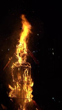Ravana, Raavan effigy frame being burnt on the hindu festival of Dussehra symbolizing the victory of good over evil on the run up to Diwali, popular public event at night