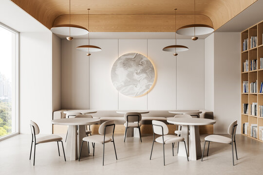 Modern minimalist lounge interior with round tables, light chairs, wood ceiling, and abstract wall art in a bright empty room with large window view. 3D Rendering