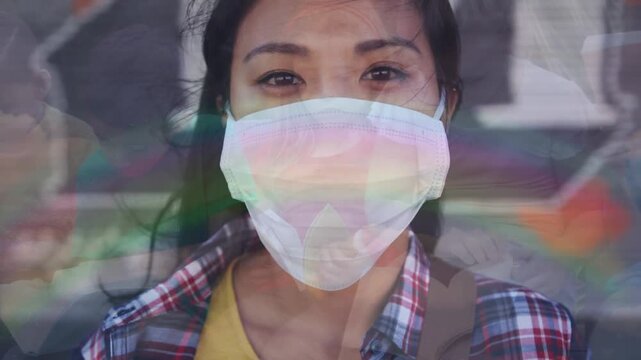 Portrait of asian woman wearing a face mask against group pf students studying at school