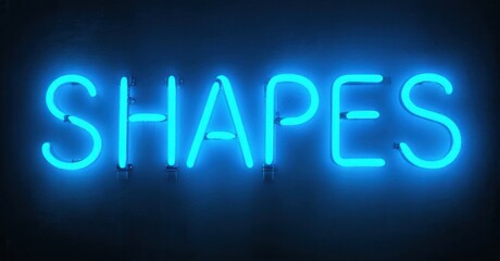 Bright blue neon sign spells SHAPES against dark background. Simple typography creates bold visual impact. Modern aesthetic.