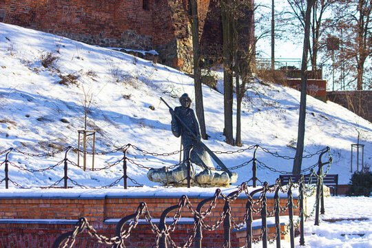 Brass statue of traditional Polish raftsman. winter. Grudziadz