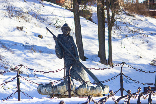 Brass statue of traditional Polish raftsman. winter. Grudziadz