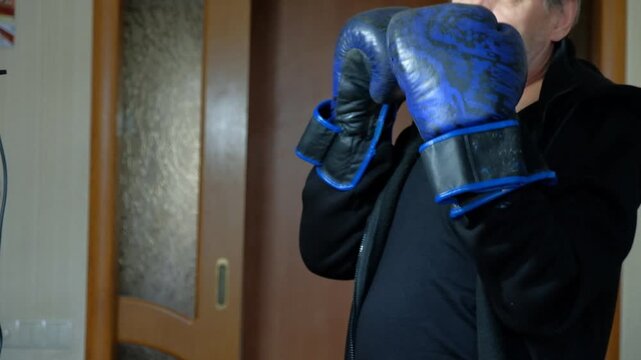 The man practices boxing and karate. The house is full of different blows.