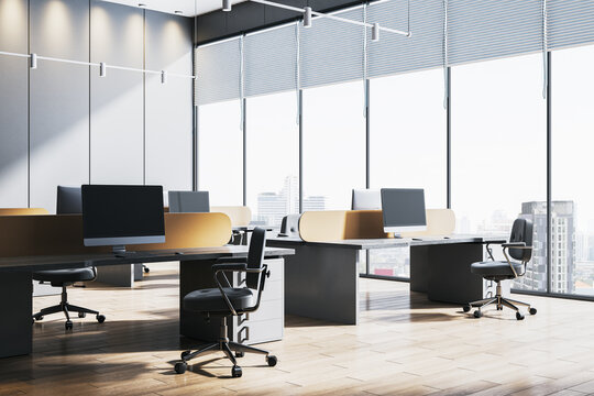 Modern open space office interior with empty workstations and large windows showing city view, minimal design and natural light concept. 3D Rendering