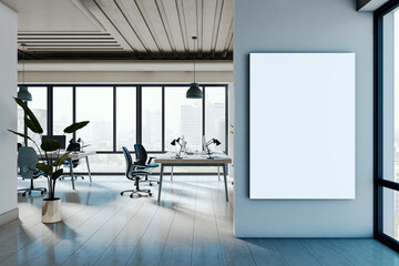 Vertical blank poster frame on modern office wall with clean interior and large windows overlooking city skyline in daylight setting. 3D Rendering