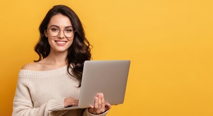 Portrait of Cheerful Young Woman with Glasses Holding Laptop Against Yellow Background with Copy Space