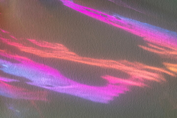 Abstract neon light streaks in pink and purple on a textured background for creative design