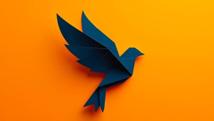 Obraz premium One paper black crow with raised wings in the upper right corner on an orange background with space for text.