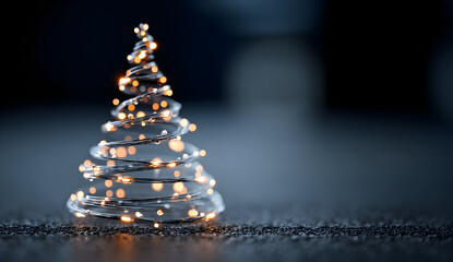 Minimalist Glass Christmas Tree with Warm Lights on Dark Background