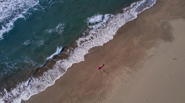 Aerial view travel scene woman in pink swimsuit relaxed on sandy beach Patara Antalya Turkey, concept freedom life style.