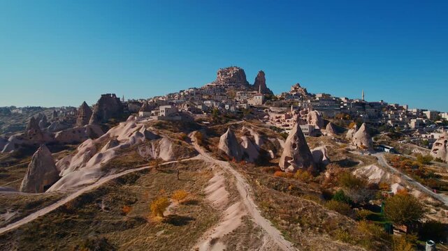Ancient Uchisar castle with underground city of Cappadocia, Goreme national park of Turkey, Aerial view.