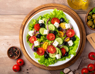 A vibrant Mediterranean-style salad served in a white bowl, filled with crisp lettuce