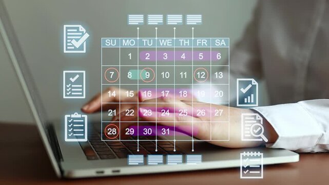 Person working on a laptop with a digital calendar displaying dates and tasks in a home office setting during daytime hours.