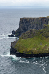 a rainy and stormy summer day at the famous cliffs of moher in the irish County Clare