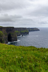a rainy and stormy summer day at the famous cliffs of moher in the irish County Clare