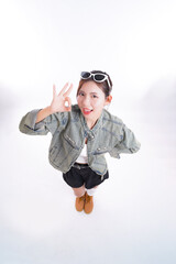 OK gesture and confidence: A confident and stylish individual, adorned with sunglasses, forms the OK hand gesture, emanating positivity and self-assurance.