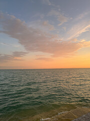 Fototapeta premium Water surface at sunset with warm light and reflections