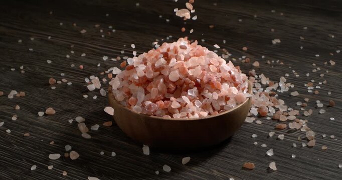 Himalayan pink salt in a super slow motion, natural mineral seasoning for healthy cooking and spa concepts. Super slow motion 1500 fps.