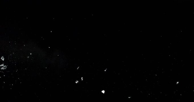 This stunning video shows glass shattering against a black background, ideal for motion graphics and visual effects, enhancing your creative projects in various artistic applications