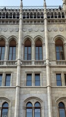 Obraz premium Facade of Parliament old building with windows detail in Budapest