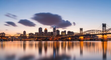 Fototapeta premium Cityscape at dusk with bridge and skyscrapers reflected in calm river waters