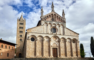 Obraz premium Historic stone church with bell tower in Massa Maritima, Tuscany