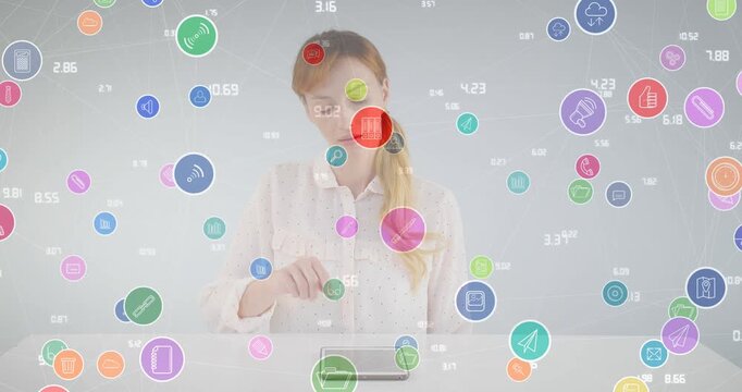Animation of network of connections with icons over businesswoman using tablet