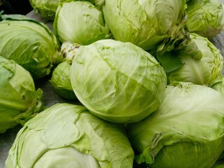 Fototapeta premium Beautiful Fresh green Cabbage heap at market Place 