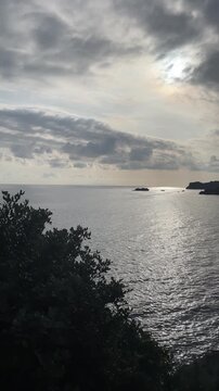 Vertical shot: crystal clear deep turquoise water at Plakias and Souda beach, southern Crete coast with rocky cliffs, beautiful mediterranean nature, greek summer