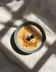 Oatmeal bowl on linen flat lay